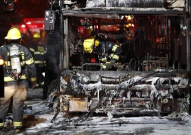 ISRAEL-PALESTINIAN-CONFLICT Israeli firefighters check out a burnt bus in the Israeli town of Holon near Tel Aviv, on May 11, 2021, after rockets are launched towards Israel from the Gaza Strip controlled by the Palestinian Hamas movement. (Photo by Ahmad GHARABLI / AFP)